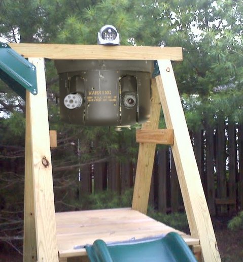 outdoor motion sensor light on swingset with machine gun turret