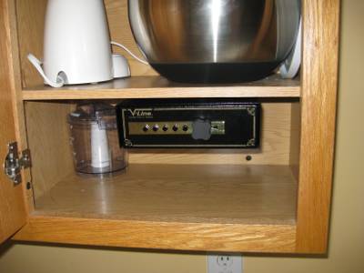 vline pistol safe mounted in the kitchen cabinet