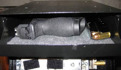 Compact pistol and magazine in tray